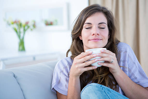 istock Peaceful woman holding cup of coffee 484977978
