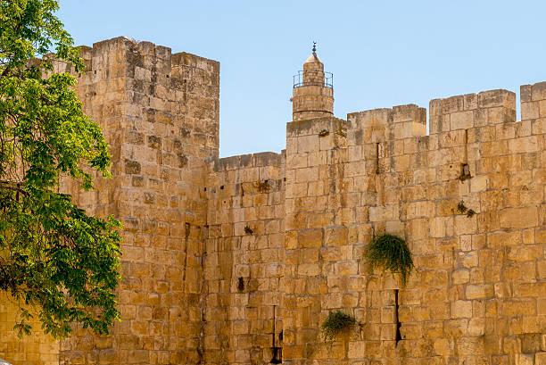 istock ancient city walls and towers in  old Jerusalem 484980370