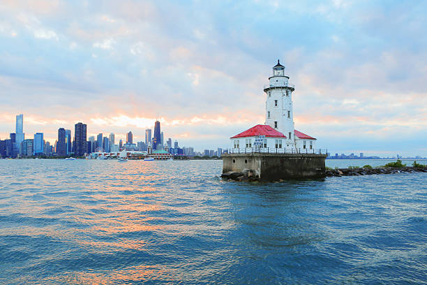 Chicago Lighthouse Chicago Lighthouse with City Skyline Background lake michigan stock pictures, royalty-free photos & images