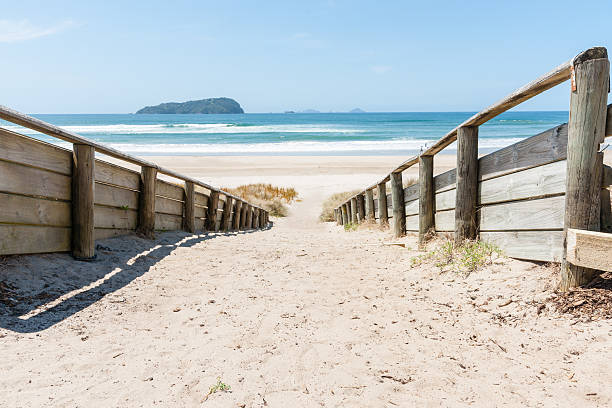 path leading to Pauanui Beach New Zealand Sand path leading to Pauanui Beach New Zealand coromandel peninsula stock pictures, royalty-free photos & images