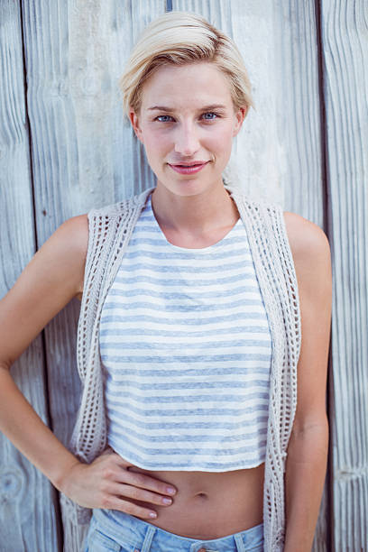 istock Pretty blonde woman smiling at the camera 484992388