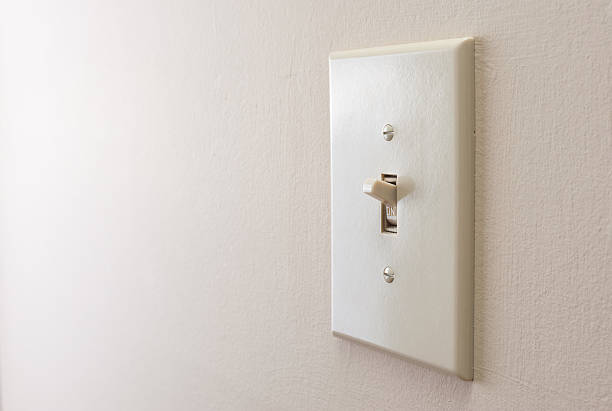 Classic light switch Classic light switch hanging on the wall light switch photos stock pictures, royalty-free photos & images