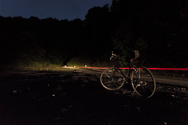 istock Bicycle standing by the road at night 484993596