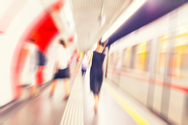 istock Motion blurred people walking in subway station. 484993598