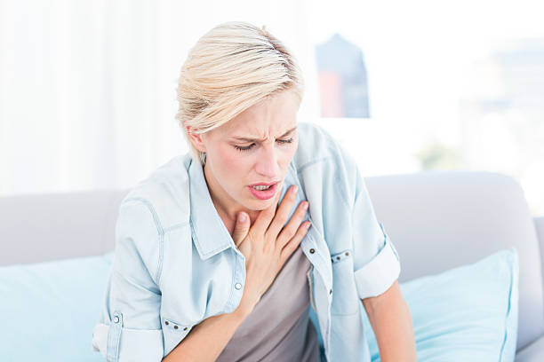 istock Pretty blonde woman having breath difficulties 484993608