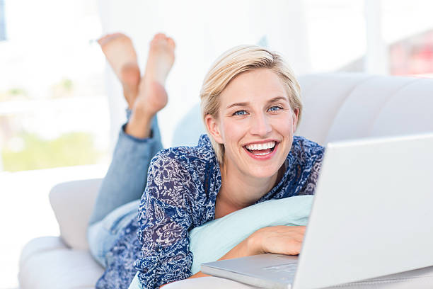 istock Pretty blonde woman using her laptop 484993914