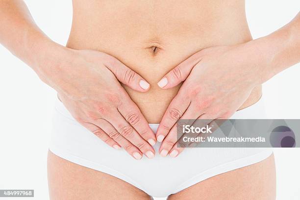 Fit Woman With Stomach Pain Stock Photo - Download Image Now - 2015, 30-34 Years, 30-39 Years