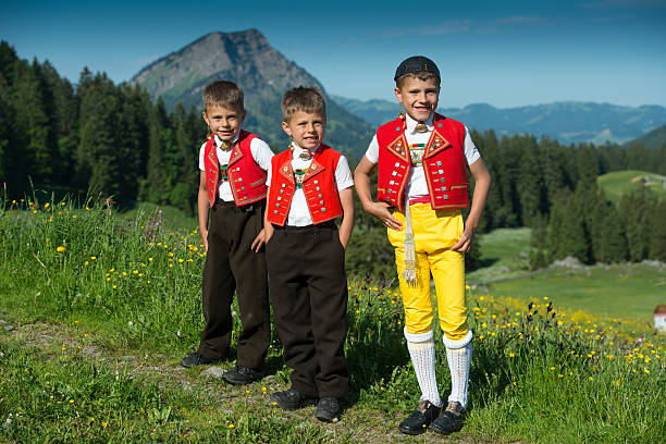 Alpaufzug Children bring their cattle to the Alps in a traditional procession called the "Alpaufzug" Schwaegalp, Switzerland traditional clothing stock pictures, royalty-free photos & images
