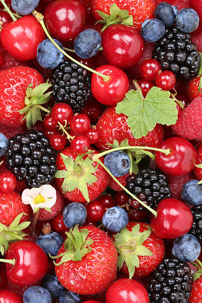 istock Berry fruits background with strawberries, raspberries and cherries 484998570