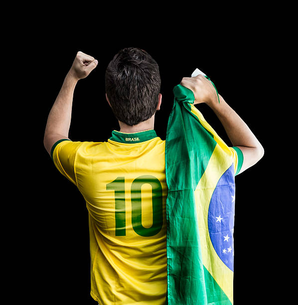 istock Brazilian soccer player celebrates on black background 485005392