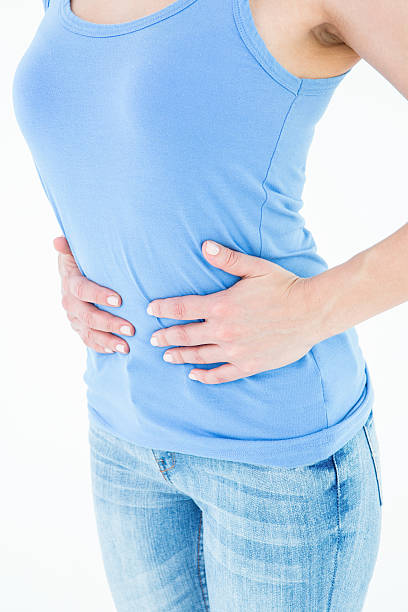 istock Woman suffering from stomach pain 485006880
