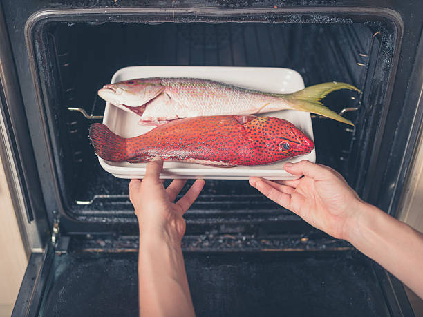 istock Exotic fish being put in the oven 485007396