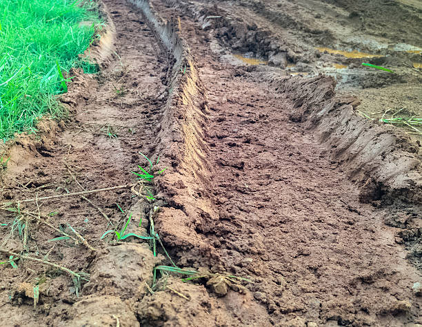 istock muddy road with tire trail 485007540