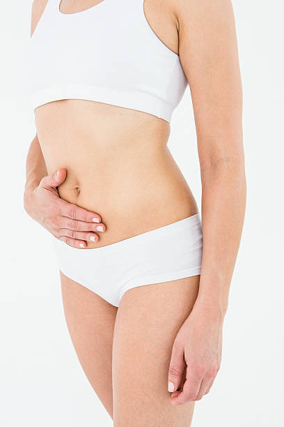 istock Fit woman suffering from stomach pain 485010636