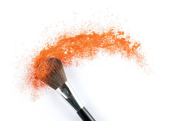 arancio ombretto polvere con un pennello, moda e bellezza - face powder eyeshadow make up make up brush foto e immagini stock