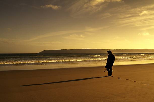 istock sunset silhouette of man dressed as pirate at beach 485011234