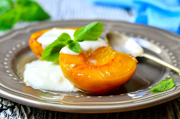 istock Grilled peach with yogurt and honey. 485011496