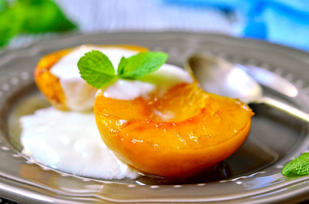 istock Grilled peach with yogurt and honey. 485011500