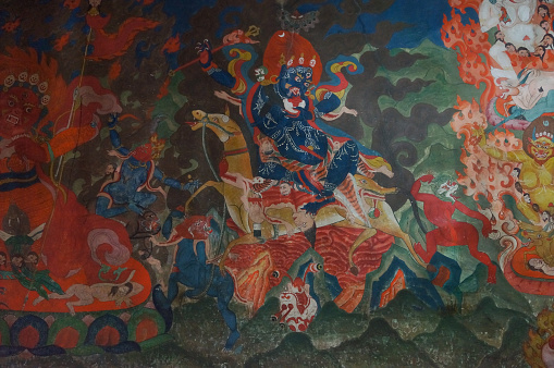 Old buddhist fresco at the wall of tibetan monastery Thiksey Gompa  in Leh,Ladakh,India.
