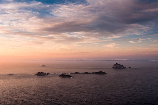 istock Ocean View by Sunrise with Islands in the Horizon 485012292