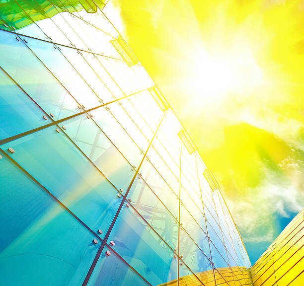 istock Sunlight of blue glass windows at closeup looking up 485012414