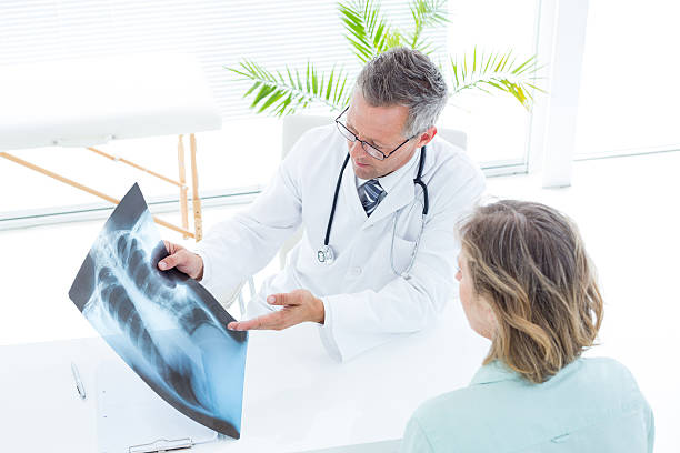 istock Doctor showing xray to his patient 485012494