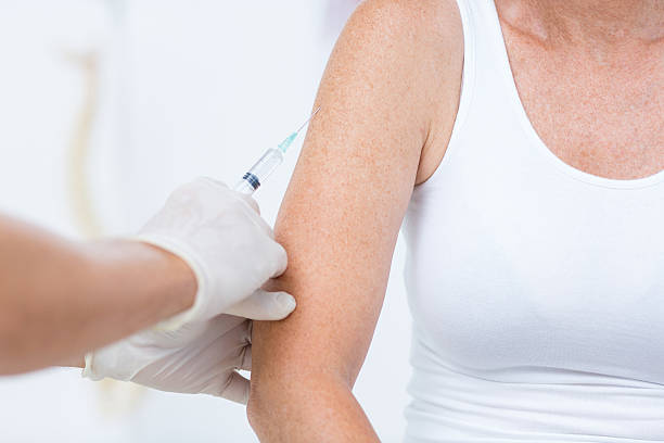 istock Doctor doing an injection to his patient 485012906