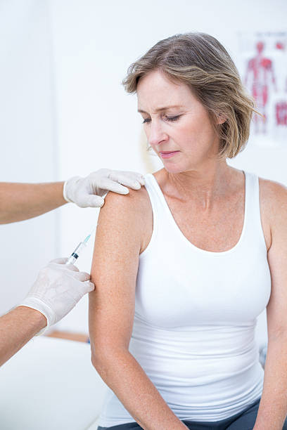 istock Doctor doing an injection to his patient 485012914