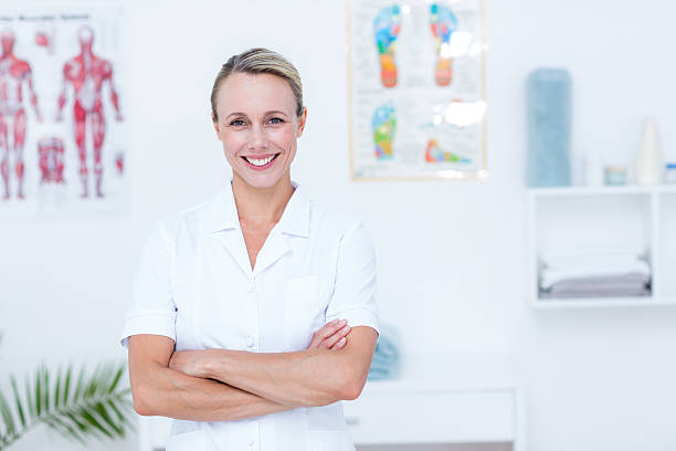 istock Smiling doctor looking at camera with arms crossed 485013386