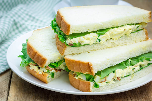 istock Sandwich with egg salad, bacon, green onion and lettuce 485016662
