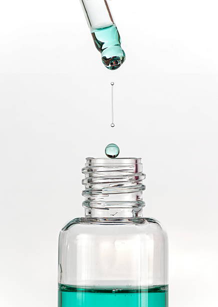 istock Drop of mouthwash dripped and falling into a clear bottle 485017793