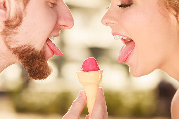 istock young couple eating ice cream outdoor 485018120