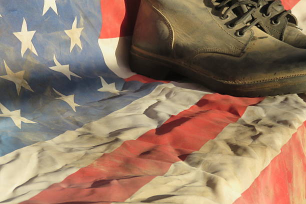istock Army combat boots with American flag 485019032