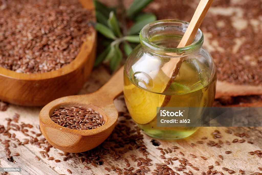 essential oil linseed essential oil of linseed in the small glass bottle Flax Seed Stock Photo