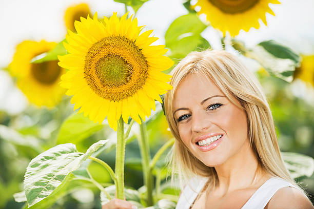 istock Beautiful woman with sunflower. 485020029