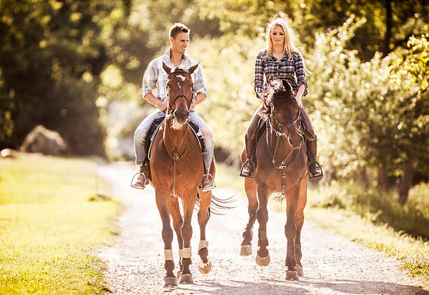istock Couple horseback riding. 485020053