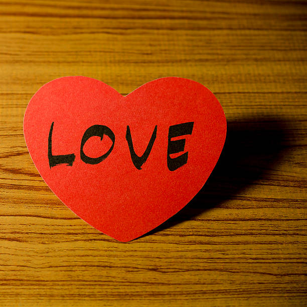 istock red heart on wood background 485023919