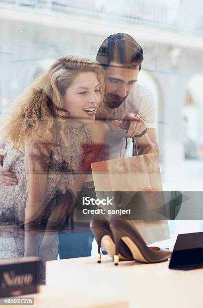 Young Elegant Couple Shopping Stock Photo - Download Image Now - Shoe, Window Shopping, Crowd of People