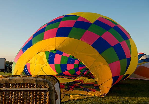 istock Envelope of hot-air balloon being inflated 485027478