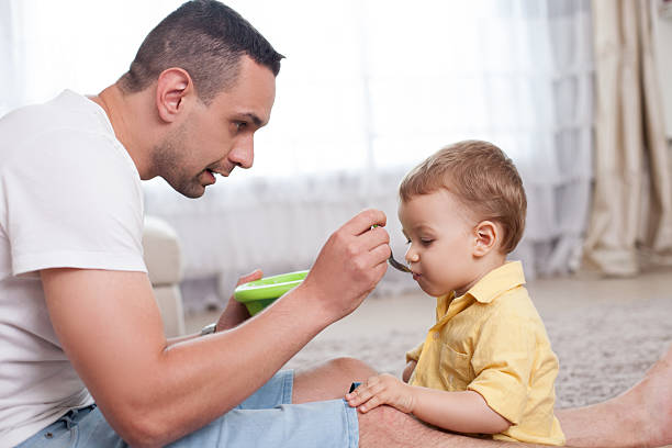 istock Attractive young man is caring his child 485035628