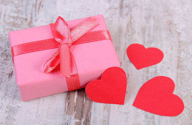 istock Gift for birthday, valentine or other celebration and red hearts 485036646