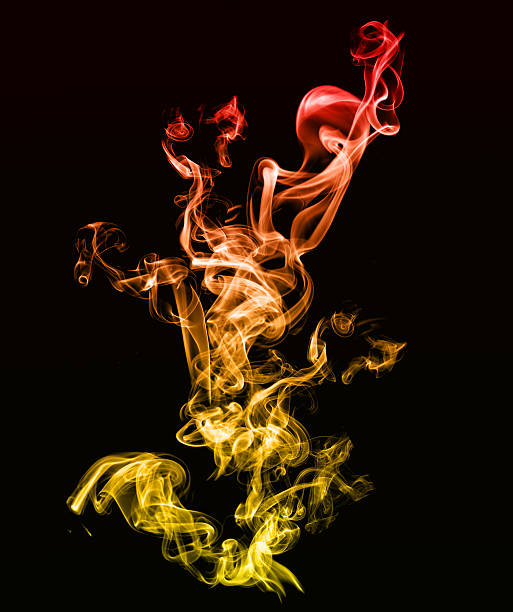 istock Beautiful golden smoke effect on black 485036702