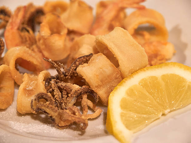 istock Fresh fried squid with lemon frutti di mare 485037580