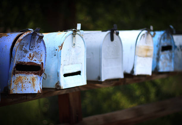 istock Line of Classic Rusty Weathered Rural US Mailboxes 485042084