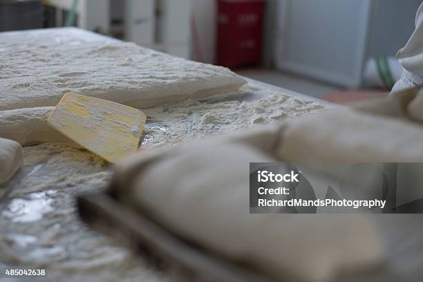 Ciabatta Bread Dough Flat With Yellow Cutter Stock Photo - Download Image Now - 2015, Baguette, Baked Pastry Item