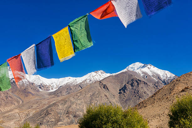 istock snow mountain range and tibetan prayer flags in the village 485046756
