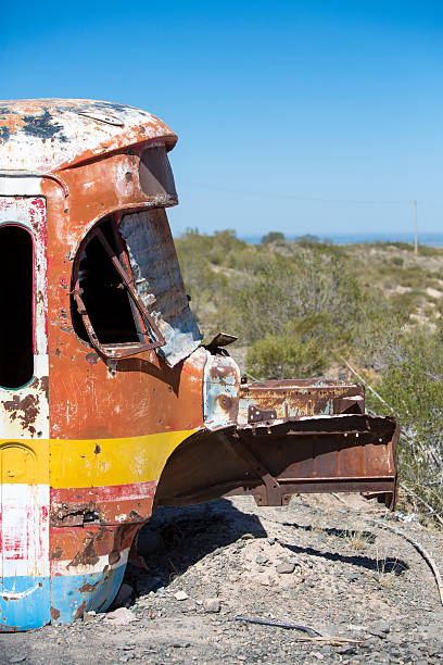 istock Rusted out old school bus abandoned in the countryside 485046862
