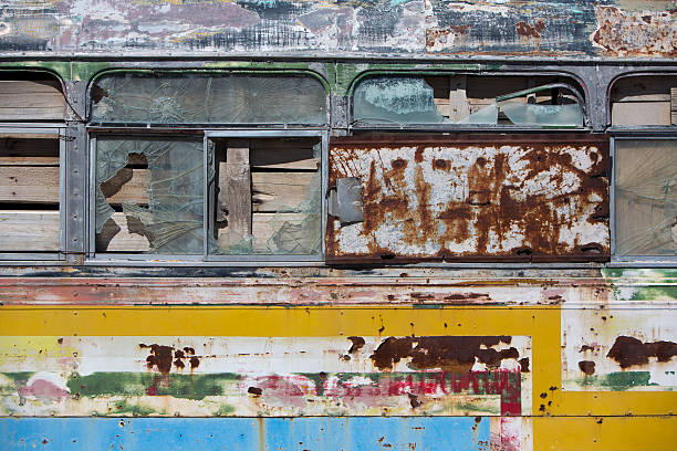 istock Rusted out old school bus abandoned in the countryside 485046870