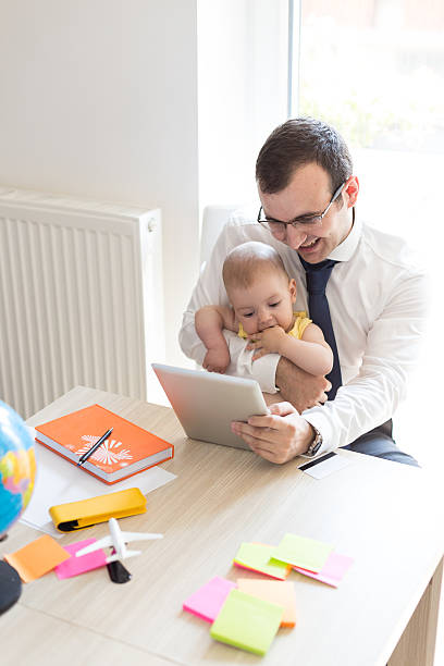 istock Father With Baby Working In Office At Home 485047312
