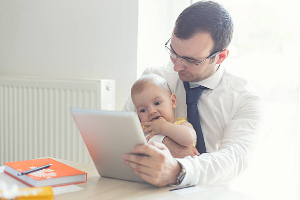istock Father With Baby Working In Office At Home 485047314
